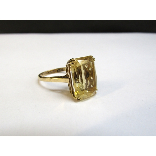 8292 - A 9ct gold ring with a rectangular yellow citrine, 14mm x 10mm. Size L, 3.7g