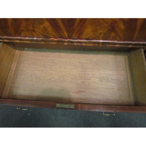 1052 - A 19th Century flame mahogany escritoire, the slim drawer over a fall-front opening to reveal a fitt... 