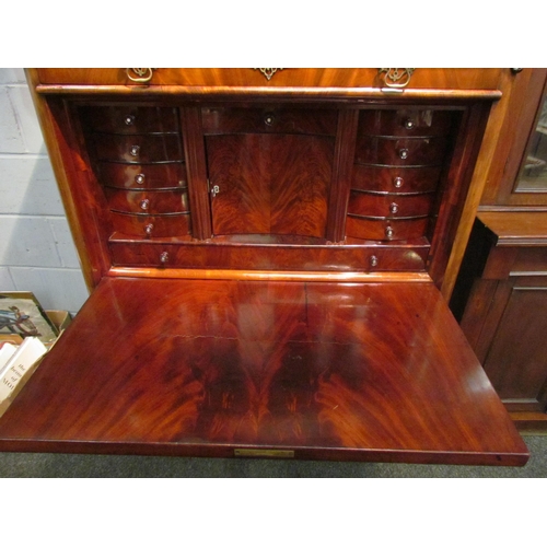 1052 - A 19th Century flame mahogany escritoire, the slim drawer over a fall-front opening to reveal a fitt... 