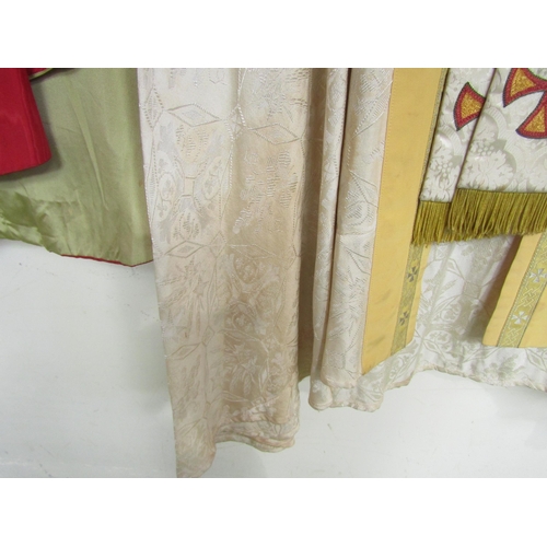 1058 - Three ecclesiastical garments to include two silk chasubles and a silk cape