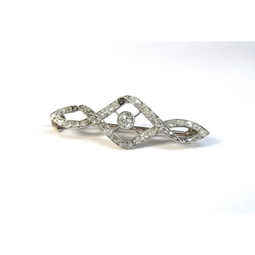 8301 - A diamond encrusted brooch, the centre diamond 0.20ct approx, framed by twisted rows of old cut diam... 