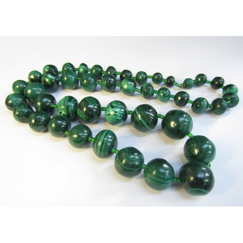 8306 - A large malachite bead necklace, 64cm long   (R) £70