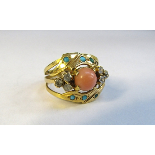 8310 - A gold ring centrally set with a coral cabochon framed with turquoise and clear stones. Size L/M, 3.... 