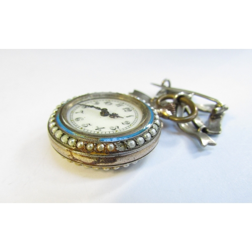 8316 - An enamel and pearl set fob watch with blue enamel bow brooch, some damage