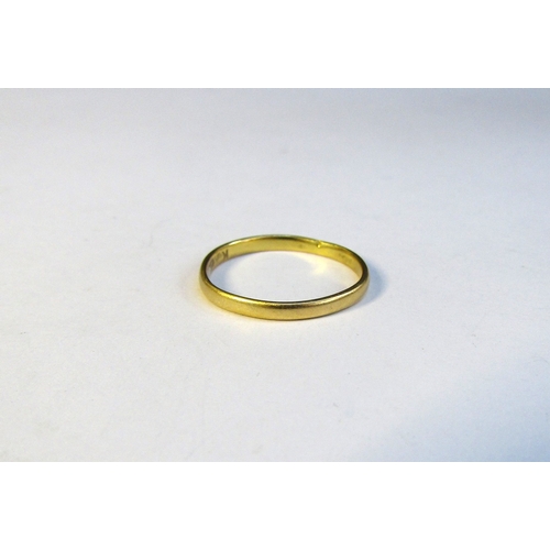 8319 - A 22ct gold wedding band. Size L/M, 1.3g