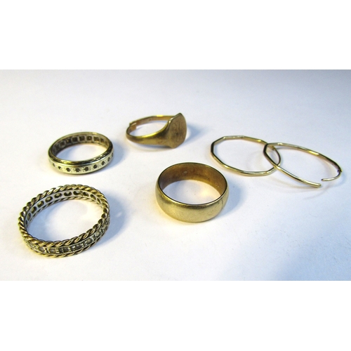 8320 - A 9ct gold wedding band, size N, 9ct gold hoop earrings, 9ct gold signet ring (cut) and two eternity... 