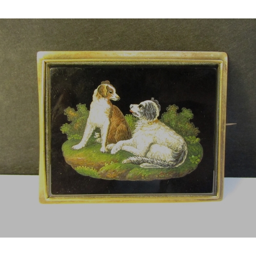 8323 - A 19th Century micro mosaic depicting two spaniels set within a rectangular black onyx panel, gilt m... 