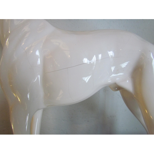 1018 - A white ceramic figure of a greyhound, 32.5cm tall