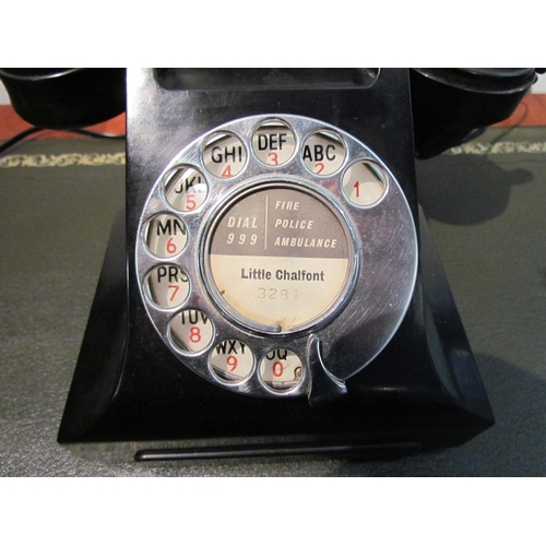 1028 - A black bakelite dial telephone, model 332L