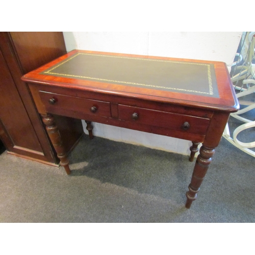 1029 - A Victorian mahogany hall table with later tooled leather top and two drawers, 72cm tall x 92cm wide... 