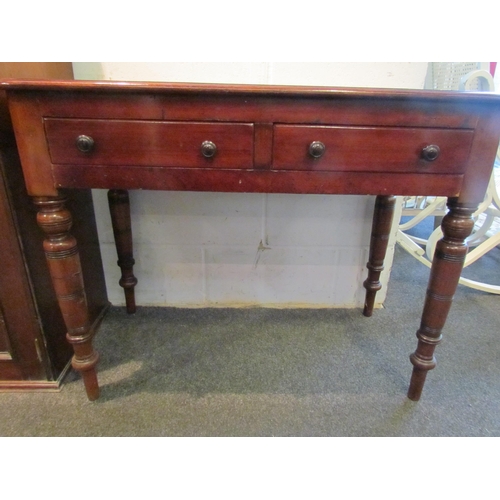 1029 - A Victorian mahogany hall table with later tooled leather top and two drawers, 72cm tall x 92cm wide... 