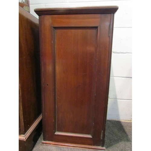 1031 - A mahogany cupboard with cast metal wine rack interior, 97cm tall x 48cm wide x 40.5cm deep