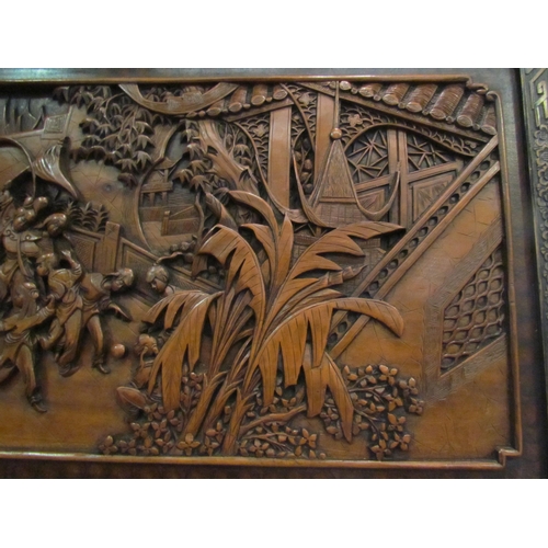 1032 - An early 20th Century Oriental carved panel depicting celebratory scenes, 45cm x 86cm   (R) £50