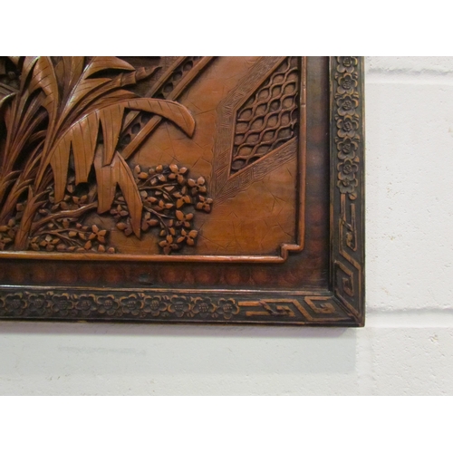 1032 - An early 20th Century Oriental carved panel depicting celebratory scenes, 45cm x 86cm   (R) £50