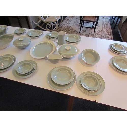 1138 - Approximately 50 pieces of retro Poole dinner wares including plates of varying sizes, lidded tureen... 