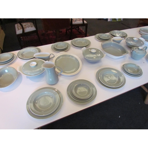 1138 - Approximately 50 pieces of retro Poole dinner wares including plates of varying sizes, lidded tureen... 