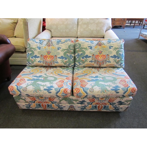 1154A - A Wesley-Barrell two seater sofa with Oriental dragon design, marks present