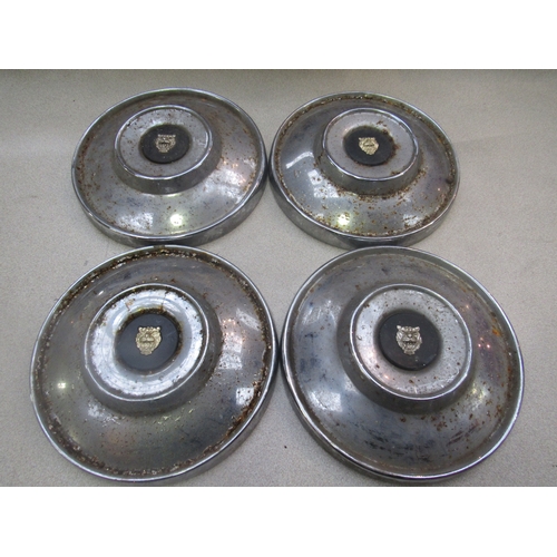 9045 - Four chromed Jaguar hubcaps