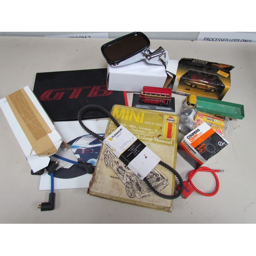 9089 - A box containing car spares including NGK spark plugs, a Haynes manual for a 1959-1978 Mini, a frame... 