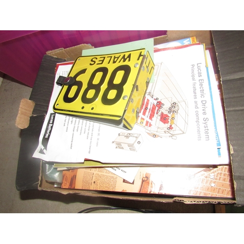9152 - A box of manuals and magazines including Wolsely, Austin and a metal number plate photo album