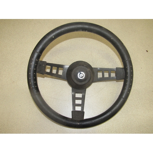 9156A - A Motec steering wheel and another