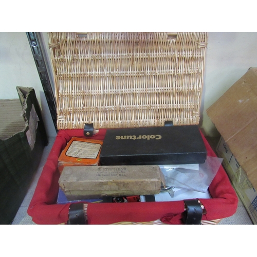 9164 - A wicker hamper containing mixed bike spares etc. including bulbs and inner tubes