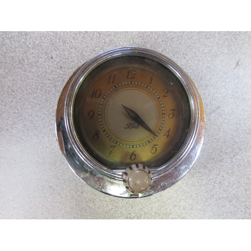 9188 - A chromed Ford dash clock and a Ford presentation clock (2)