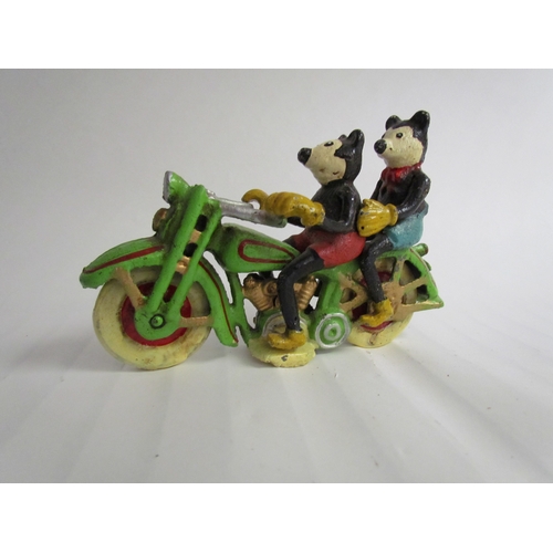 9207 - A cast reproduction figurine of Mickey and Mini Mouse riding a motorcycle