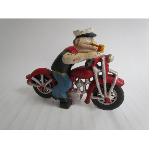 9208 - A cast reproduction Popeye riding a motorcycle figurine