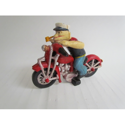 9208 - A cast reproduction Popeye riding a motorcycle figurine
