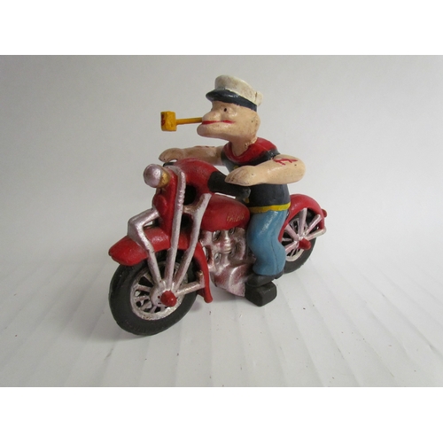 9209 - A cast reproduction Popeye riding a motorcycle figurine