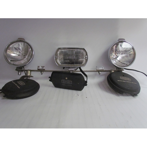 9225 - A lamp bar with three chromed Lucas Quartz-halogen lamps with covers