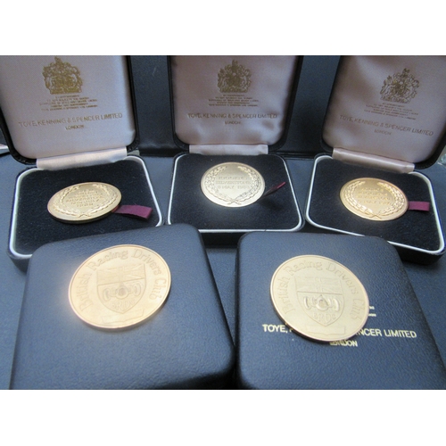 9243 - Five British Racing Drivers club medallions in cases. 1985, 86, 87, 88, and 1989     (C)