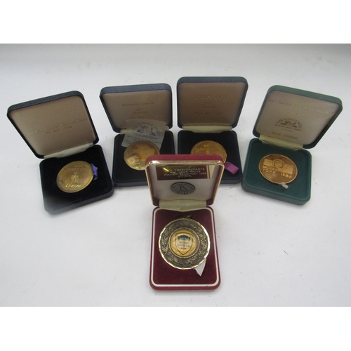 9245 - Three RAC 'Norwich Union' medallions, an RAC Rally of Great Britain 'York' medallion and a 1999 Hist... 