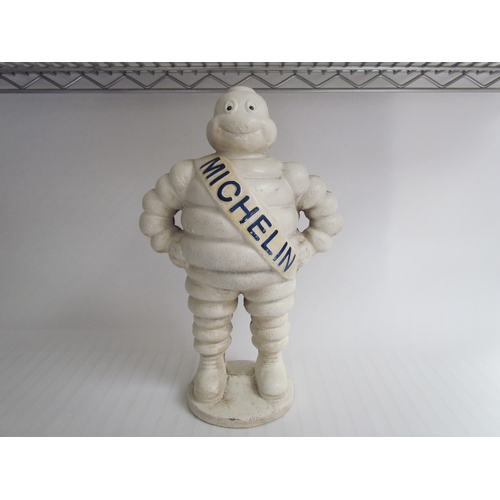 9251 - A reproduction standing cast Michelin Man, 37cm tall