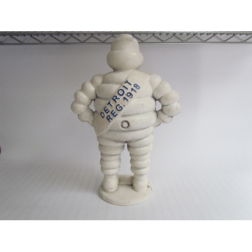 9251 - A reproduction standing cast Michelin Man, 37cm tall