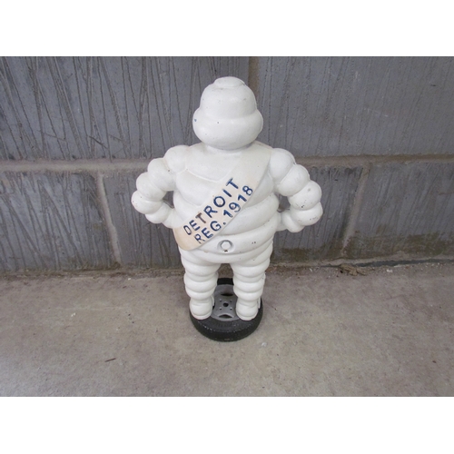 9252 - A reproduction cast Michelin Man standing on a wheel, 40cm tall