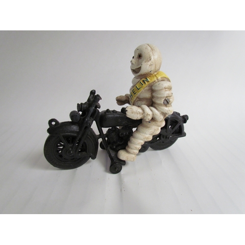 9254 - A reproduction cast Michelin Man riding a motorcycle - missing handle bars