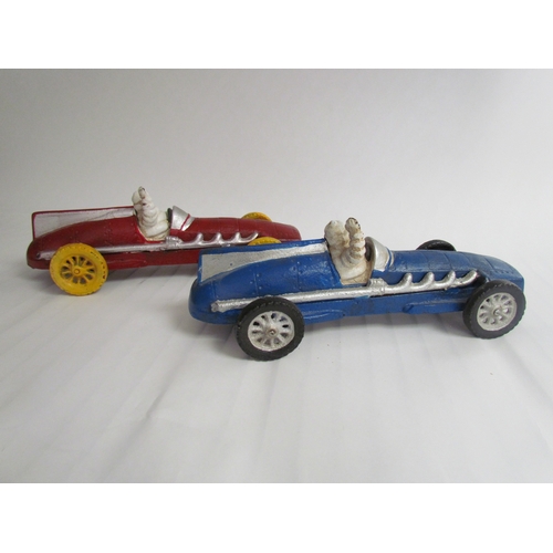 9259 - Two cast reproduction Michelin Men in vintage race cars