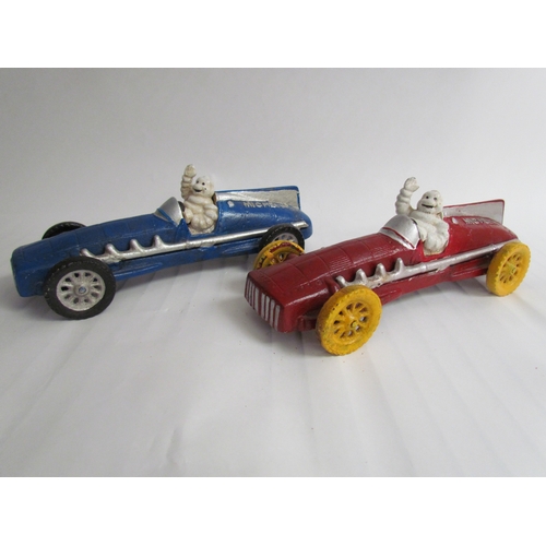 9259 - Two cast reproduction Michelin Men in vintage race cars