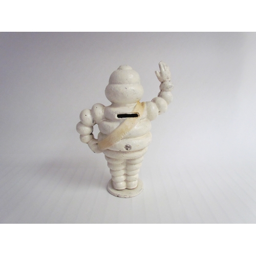 9262 - A reproduction cast waving Michelin Man, 22cm tall