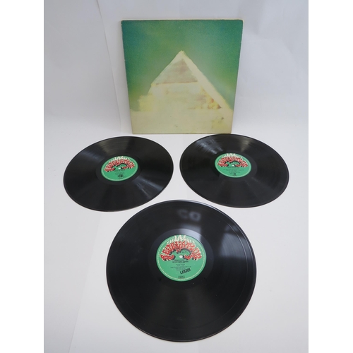 7117 - 'Glastonbury Fayre- The Electric Score' 1972 triple LP in fold out poster sleeve, no inserts or plas... 