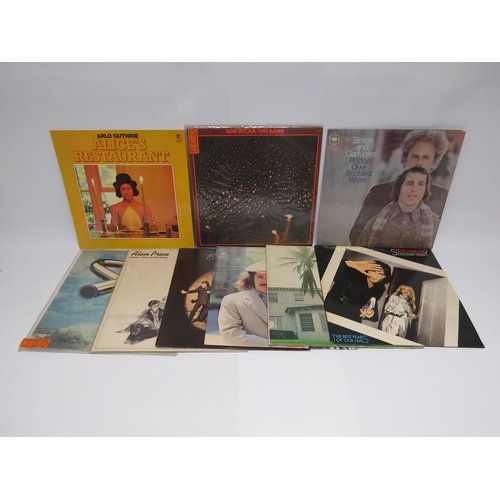 7154 - A collection of nine assorted LPs to include Bob Dylan, Arlo Guthrie, Mike Oldfield, Wings, Simon & ... 