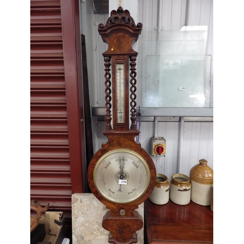 1064 - A Victorian walnut barometer with barley twist columns, 113cm high   (R) £150