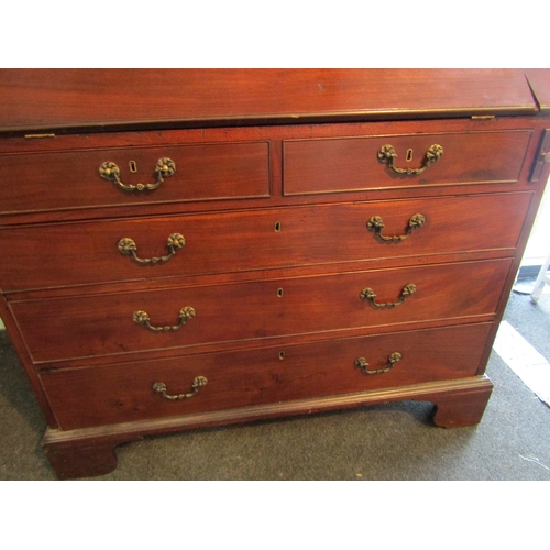 1003 - A George III mahogany bureau, drop-flap with fitted interior including secret column drawers, two sh... 