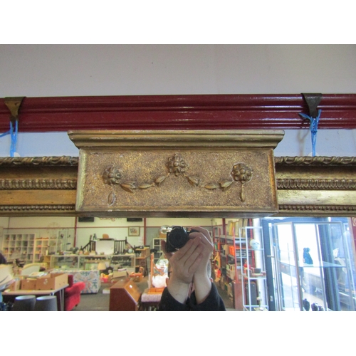 1013 - A 19th Century gilt and gesso framed rectangular wall mirror with swag embellishment, 77cm x 120cm t... 