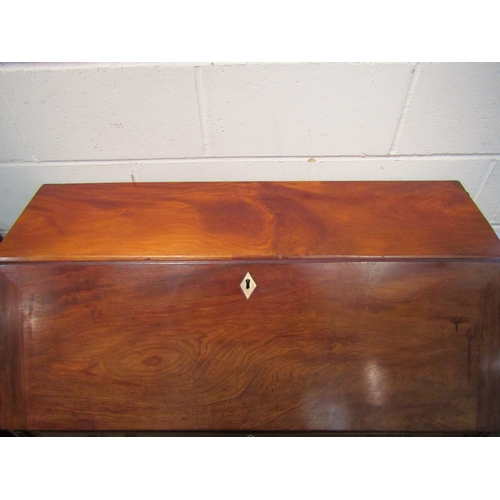 1021 - A George III mahogany bureau, the drop-flap with fitted interior over four graduating long drawers, ... 