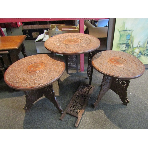 1061 - An Indian hardwood occasional table with inlaid brass and leaf and vine carved detail (a/f). Two Ind... 