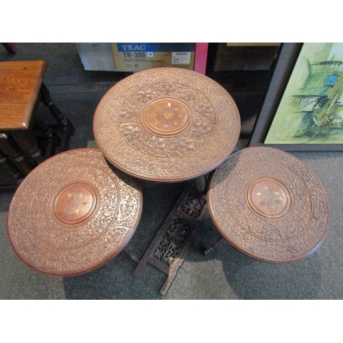 1061 - An Indian hardwood occasional table with inlaid brass and leaf and vine carved detail (a/f). Two Ind... 