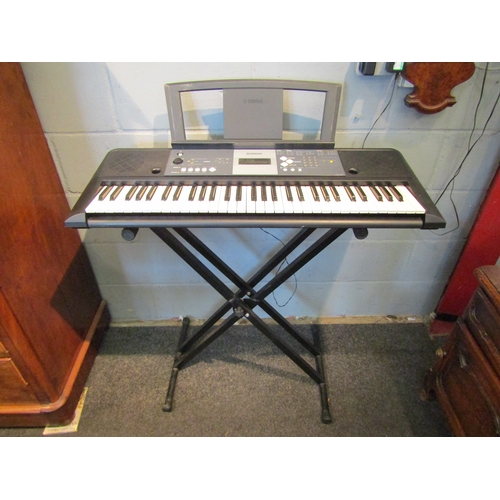 1064A - A Yamaha YPT-230 electric keyboard on stand with power lead